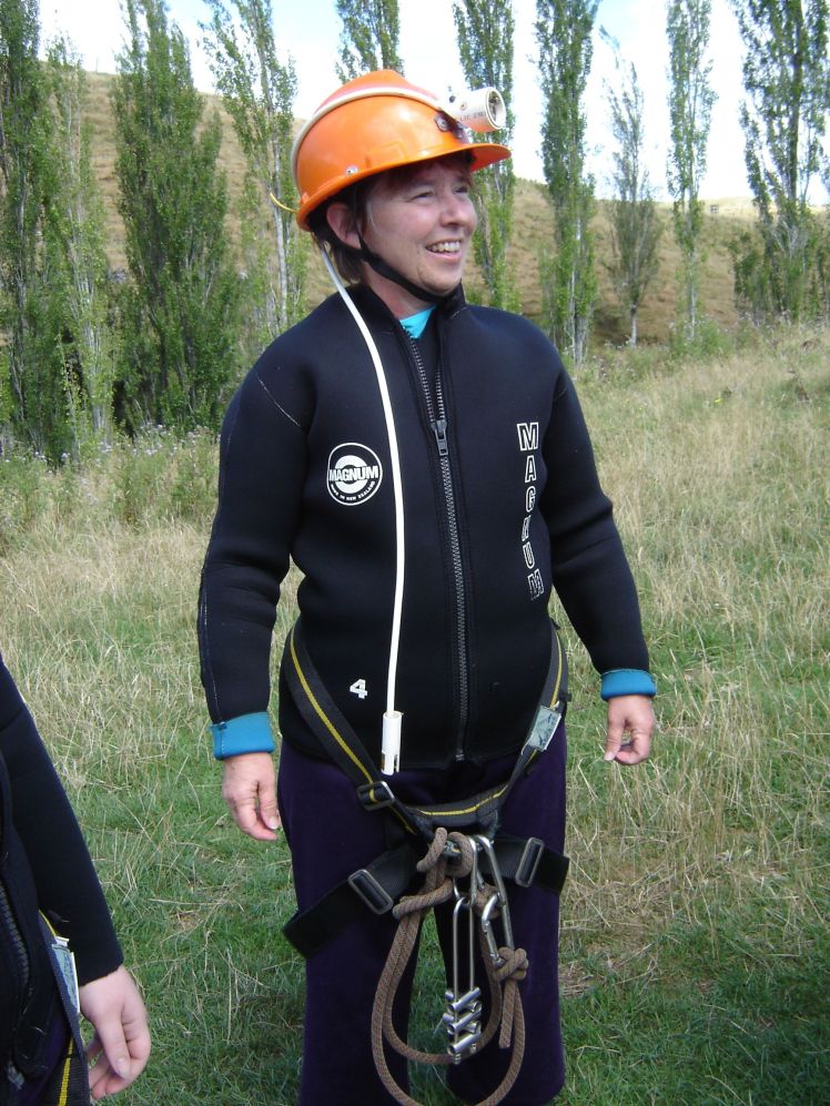 My mum preparing for caving, rock climbing and abseiling in New Zealand, February 2005