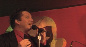 R Kevin Garcia Doyle in screen shot from He Makes You Laugh music video