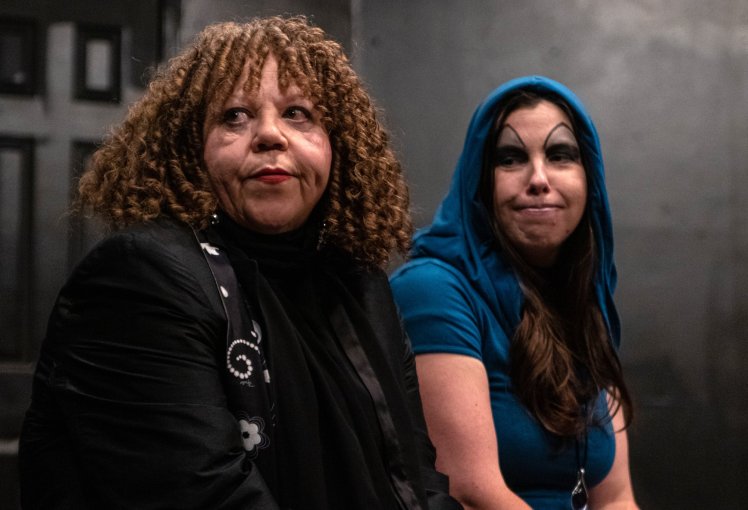 Diana Brown and Dominica May as Villains looking off stage