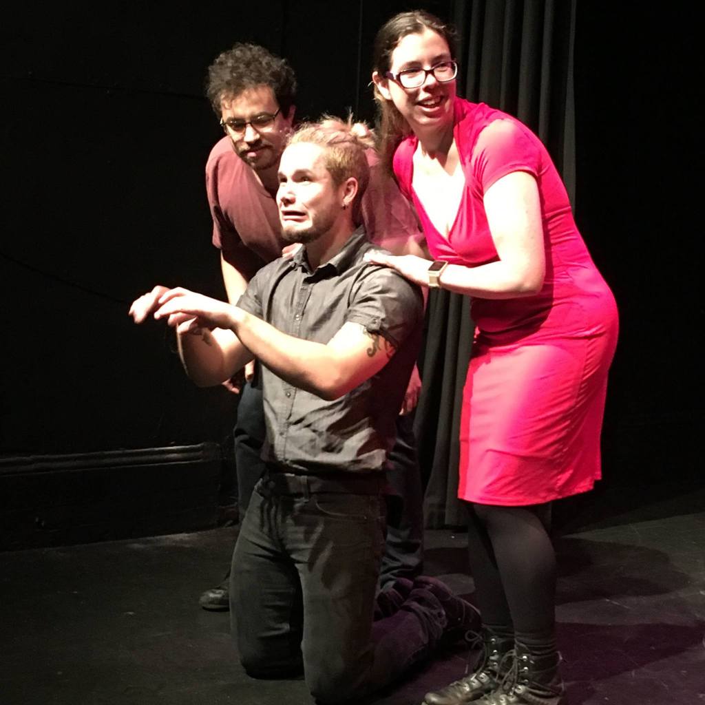 Michael Ashkar watches what a distressed Adrian Bosada is doing, while Dominica looks at something off camera with a smile.